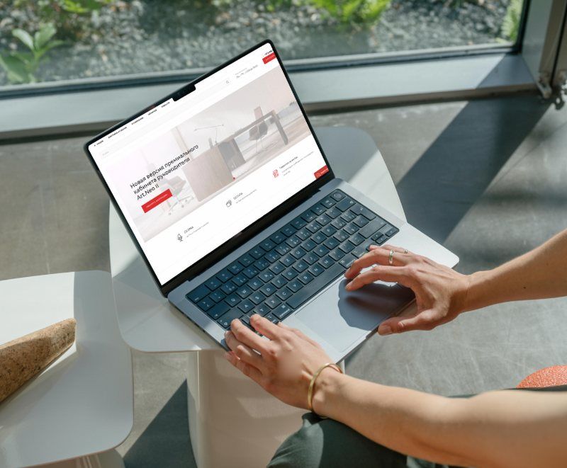 Office furniture store website in Moscow on a laptop