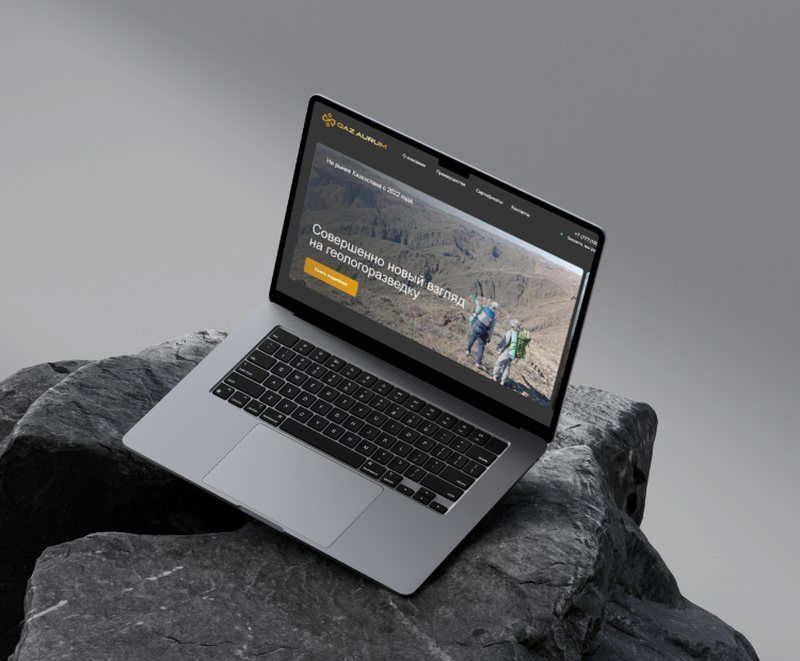 QazAurum geological exploration company website on a laptop
