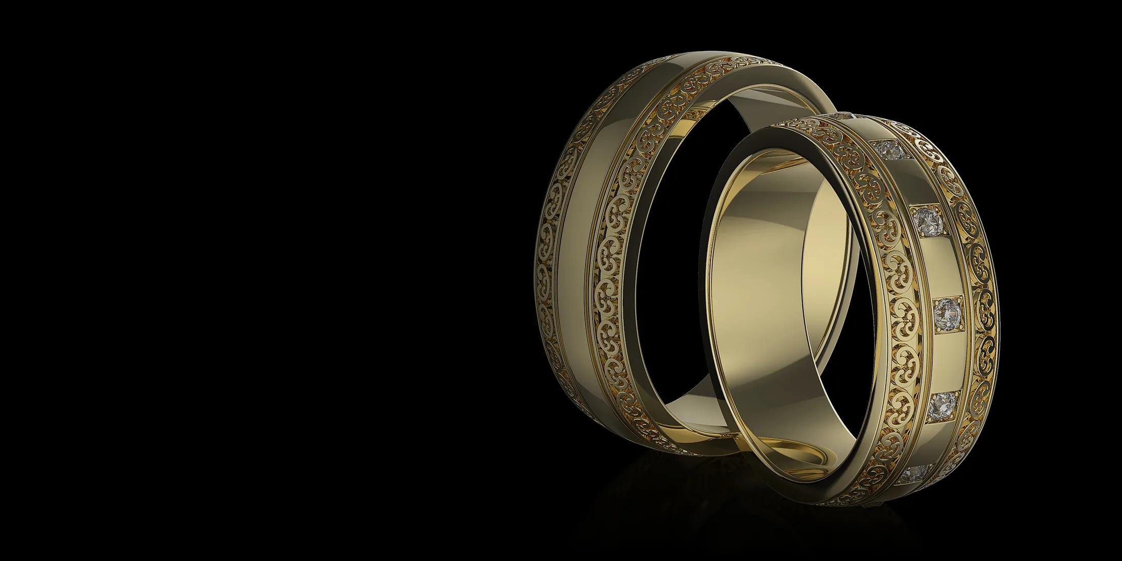Пара обручальных колец из жёлтого золота с узором и вставками